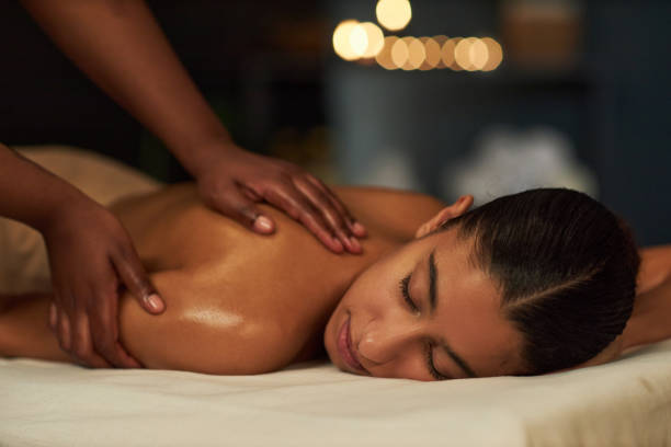 Professional therapist performing traditional Arabic massage in Dubai spa using natural oils and ancient techniques.